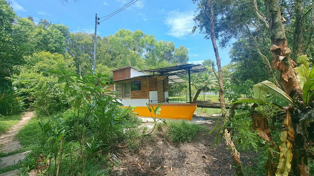 Boat House 3 with an orange hull and open deck