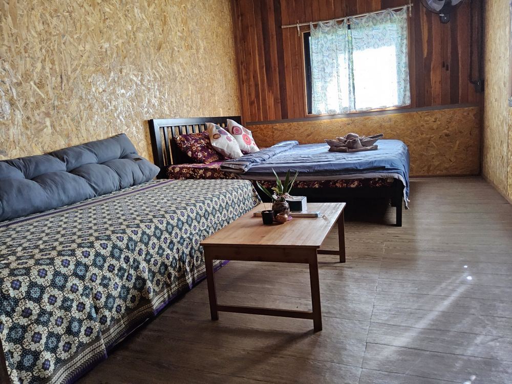 Large room with a double bed and a daybed