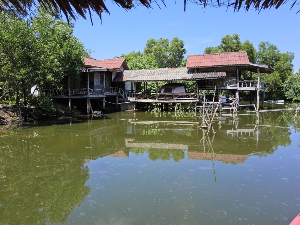 Nok Khao House, a wooden stilt house on the canal